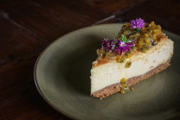 Slice of cheesecake with passion fruit