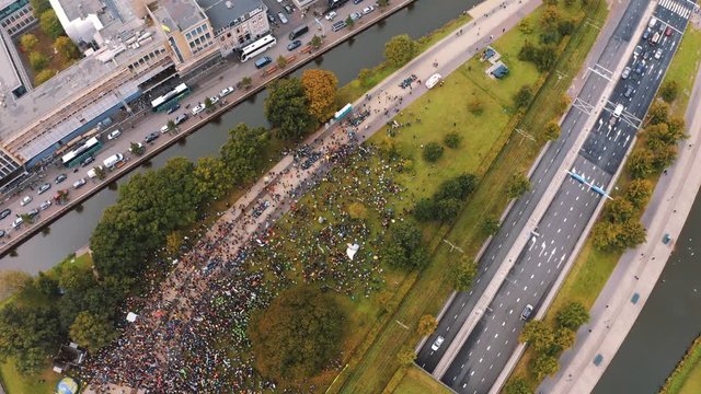 Aerial Drone view of Den haag centraal train station during climate strike protests