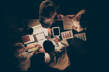 High angle above view photo of four busy hard-working business men women working overtime late...