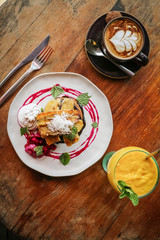 Stack of vegan pancakes , coffee and juice