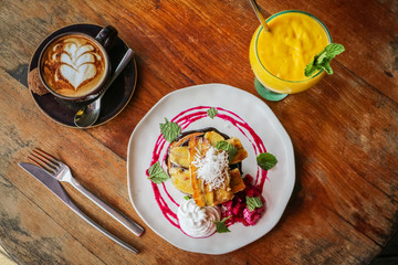 Stack of vegan pancakes and coffee and juice