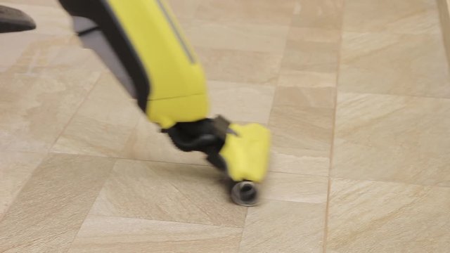 Cleaning tiles with machine