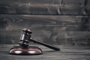 Judge Gavel on a black wooden background.