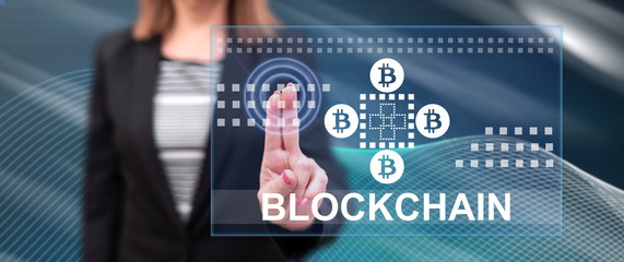 Woman touching a blockchain concept