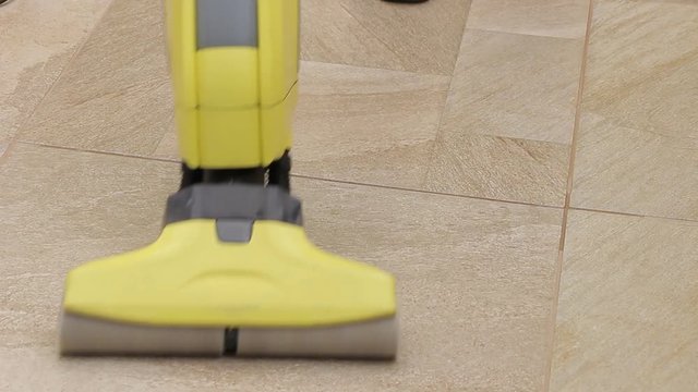 Cleaning tiles with machine