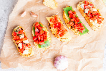 Italian bruschetta with cheese and tomatoes