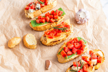 Italian bruschetta with cheese and tomatoes