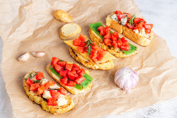 Italian bruschetta with cheese and tomatoes