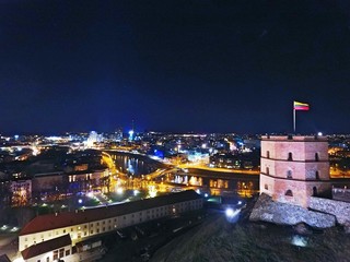 Gediminas' tower and Vilnius downtown at night. Drone footage.