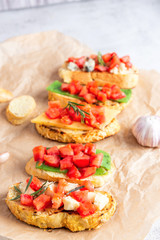 Italian bruschetta with cheese and tomatoes