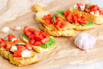 Italian bruschetta with cheese and tomatoes