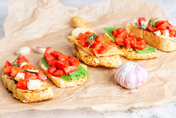 Italian bruschetta with cheese and tomatoes