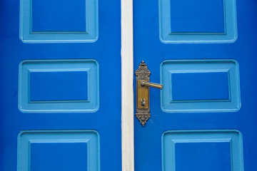 Part of a decorative blue and white door in historical town São Luíz do Paraitinga, Brazil