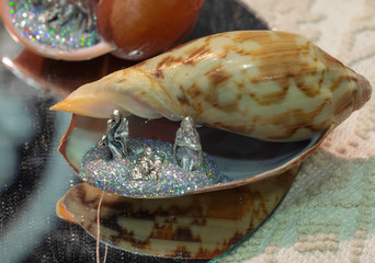 silver Nativity scene in a shell