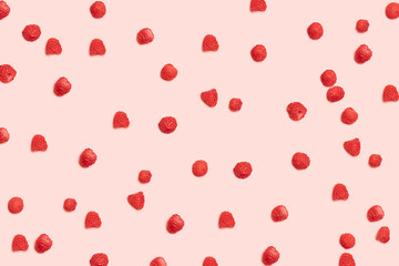 Healthy Food and Nutrition. Juicy ripe red raspberry berries pattern on a pink background.
