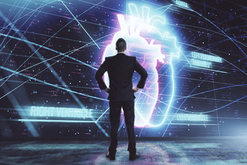 Man and heart drawing hologram. Double exposure. Concept of medical education