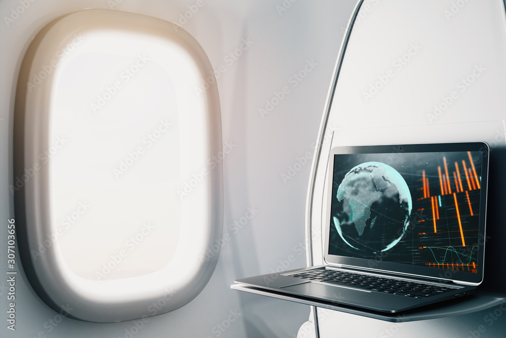 Poster laptop closeup inside airplane with forex graph and world map on screen. financial market trading co