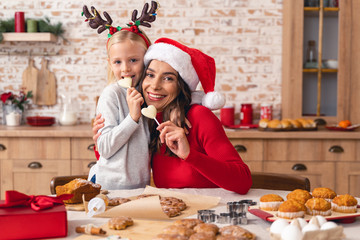 Smiling woman looking at a little girl