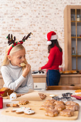 Female child sitting at the kitchen table