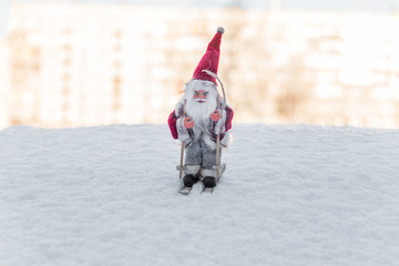 Santa Doll with Skis on Snow for Christmas