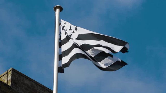 Close-up shot of the french Brittany flag, emblem of the identity of this region of France.
