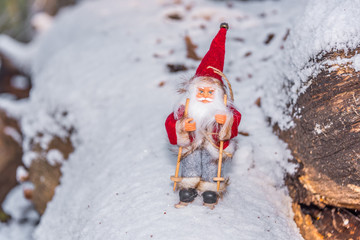 Santa Doll with Skis on Snow for Christmas
