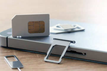 smartphone technology, replacement of MIS card and flash drive on a smartphone close-up © Антон Скрипачев