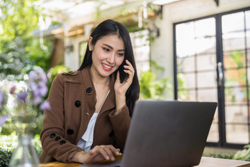 business women and laptop in the garden