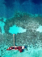 Aerial view of water chalet in Egang Egang near Bum Bum Island during sunrise.