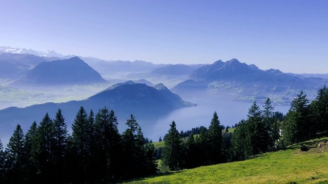 Scenic aerial view from the Rigi peak in swiss Alps mountains.  Landscape panorama in pastel colours. Popular family hiking trail.