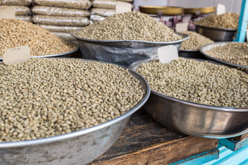 Green unroasted coffee beans for sale in a market