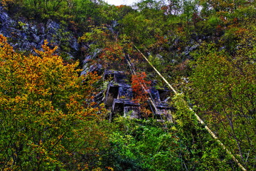 old construction covered by nature gives an historic landscape