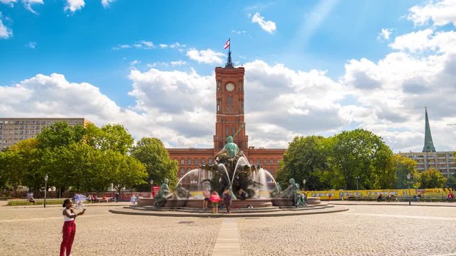 The Rotes Rathaus is the town hall of Berlin, located in the Mitte district on Rathausstra&szlig;e near Alexanderplatz. Berlin time lapse of clok on town hall in germany time lapse close up view.