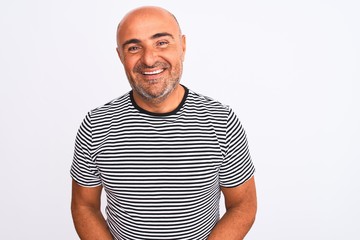 Middle age handsome man wearing striped navy t-shirt over isolated white background with hands together and crossed fingers smiling relaxed and cheerful. Success and optimistic