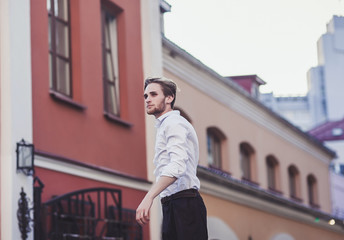 portrait of a successful man on a city street in a shirt