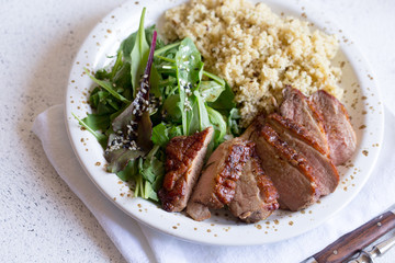 healthy lunch. Serving Couscous with Salad and Roasted Duck Breasts