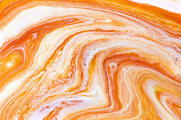 Burnt orange liquid and white foam mixing raster background. Colorful fluid splashes realistic...