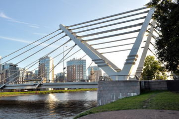View of a modern bridge in a modern area of the city. It can be used in banners, posters, for printing on fabric, bag, mug, calendar, as background, etc.