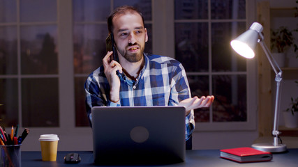 Businessman having an argument conversation over the phone