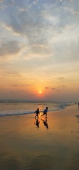 Fototapeta premium silhouette of man on beach at sunset