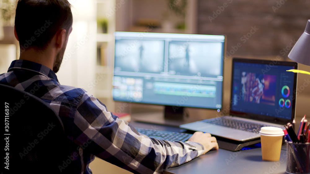Poster content creator working on post production for a multimedia project
