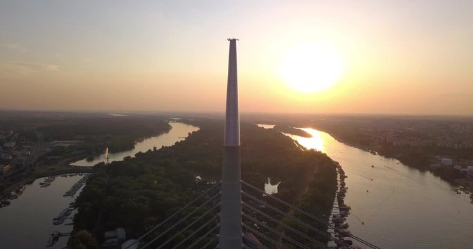 Drone view of Ada bridge and Sava river in Belgrade during sunset