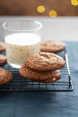 Christmas cookies and milk. Lights of the new year tree.