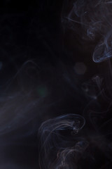 Smoke on a black background.