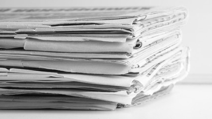 Newspaper Pages Stacked in Pile, Close up    