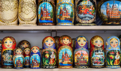 Wooden Nesting Dolls or Russian Matryoshka Dolls in the street market in Russia, nesting dolls  - traditional Russian souvenirs for tourists