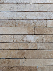Stone rock tile bricks for wall in brown color as modern background wallpaper made of natural material