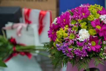 Beautiful wedding colorful purple bouquet for bride. Beauty of colored flowers. Flowers backgrounds . Beautiful bunch of purple flowers with white, red and yellow flowers .