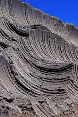 Interesting traces on clay made by the excavator during its operation. Visible result of excavator digging.