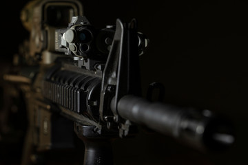 m4 rifle with optical sight and laser device